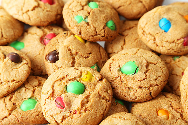 istock Cookies with colorful candy background 469164730