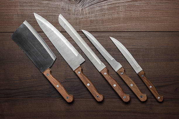 istock kitchen knifes on the brown wooden table 469165221