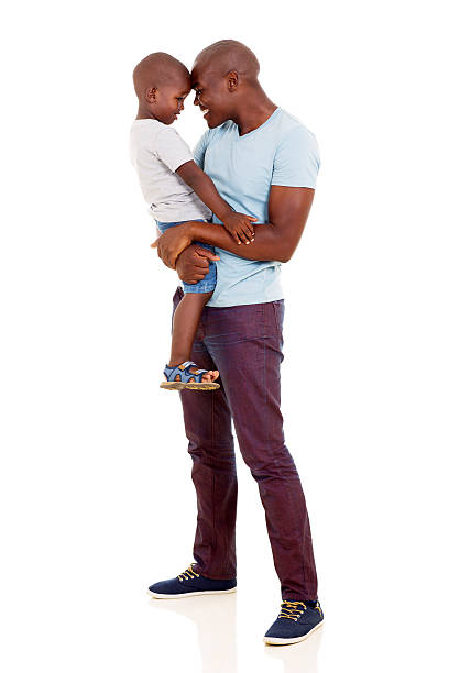 istock african man carrying his little boy 469167912