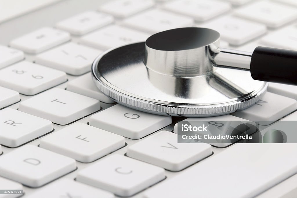 stethoscope on keyboard close up of a stethoscope on a keyboard Antivirus Software Stock Photo