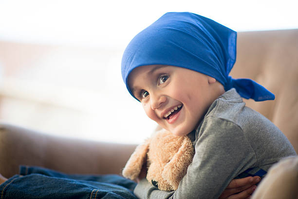 Little Boy Chemotherapy Little boy and his teddy bear after a chemotherapy treatment bandana photos stock pictures, royalty-free photos & images