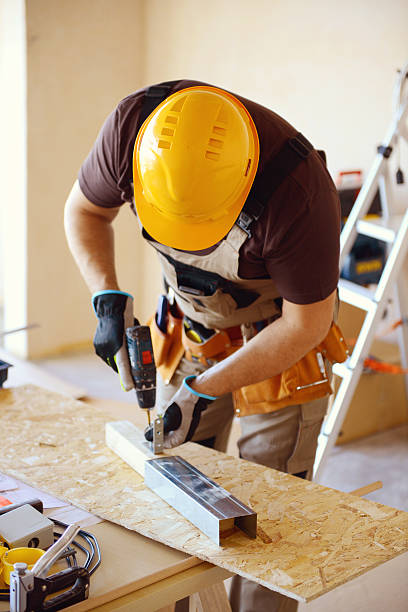 istock Male carpenter in working clothes in a construction workshop 469174610