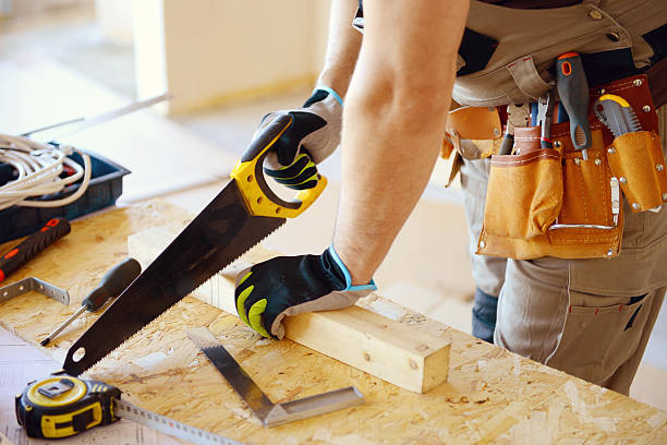 istock Male carpenter in working clothes in a construction workshop 469174628