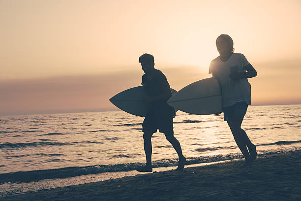 istock Two Boys with Surf Boards at Sunset 469174747