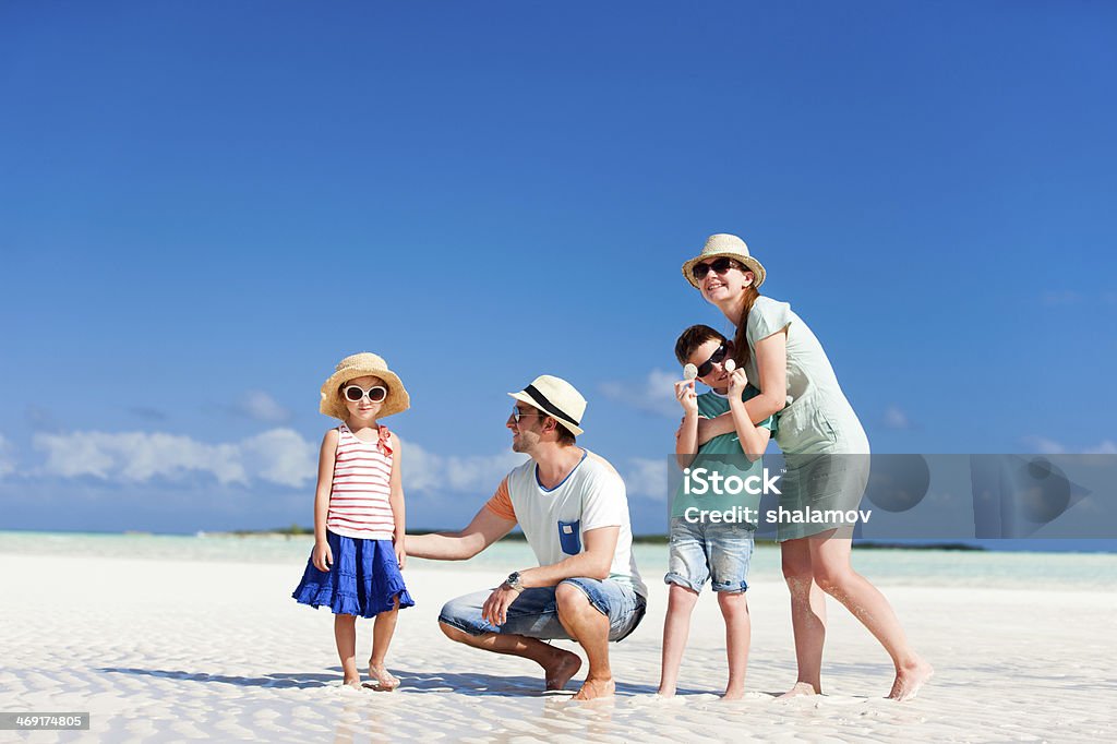 Family on summer vacation Happy beautiful family on a beach during summer vacation Adult Stock Photo