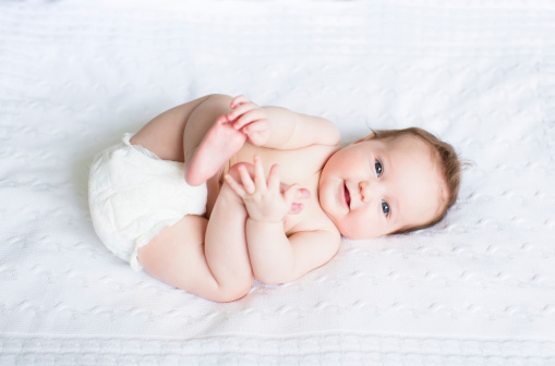 Cute little baby sleeping in sofa at home.