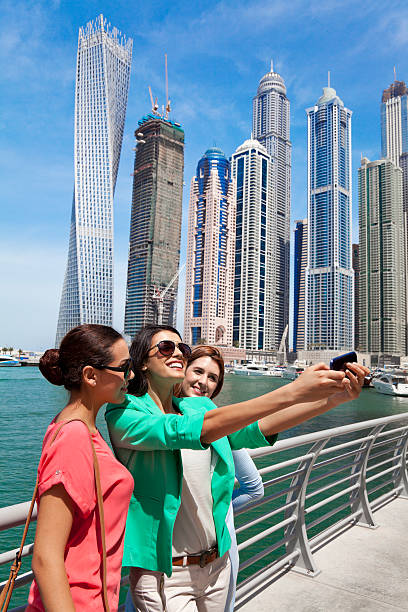 istock Three women take selfie in Dubai Marina. 469177616