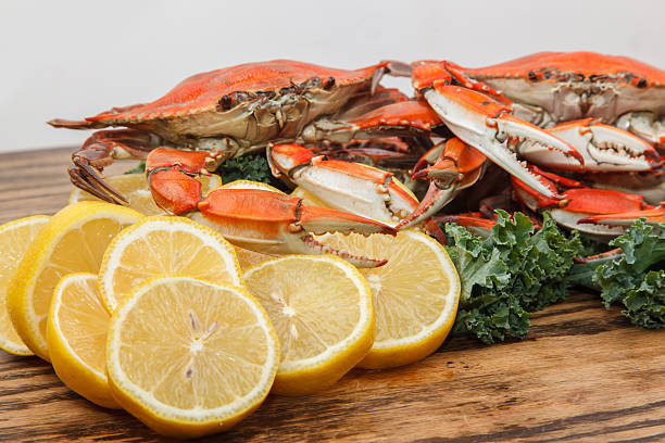istock Steamed Blue Crabs on a wooden table 469180445