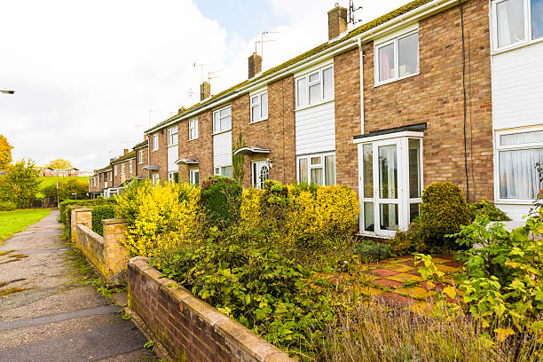 istock A row of English homes with brick cladding. 469181169