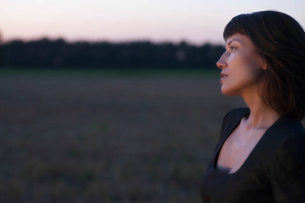 istock Woman Looking Away In Field At Twilight 469181339