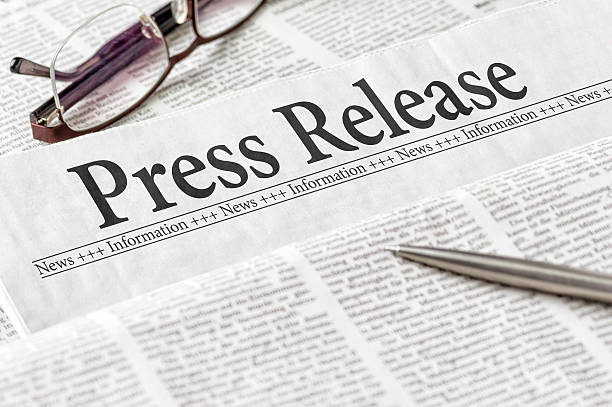Newspaper with the headline Press Release A newspaper with the headline Press Release announcement message photos stock pictures, royalty-free photos & images