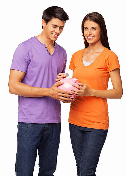 młoda para oszczędności-izolowano - purple orange heterosexual couple young men zdjęcia i obrazy z banku zdjęć