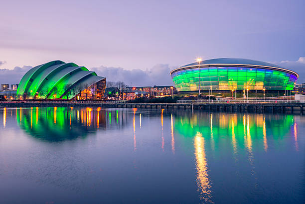 SECC, Glasgow Glasgow, UK - February 6, 2014: The Scottish Exhibition and Conference Centre Clyde Auditorium (commonly known as the Armadillo) and the Scottish Hydro Arena lit up green at night and reflected in the River Clyde as it flows through Glasgow. glasgow scotland stock pictures, royalty-free photos & images