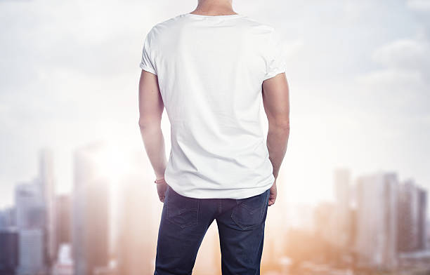 istock Man in white t-shirt on blurred city background 469183680