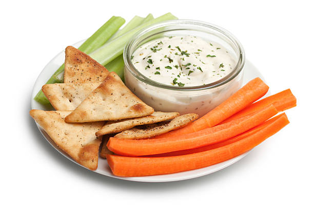 Healthy veggie snack Healthy snack with carrot and celery sticks, dip and pita chips. carrot isolated vegetable nobody stock pictures, royalty-free photos & images