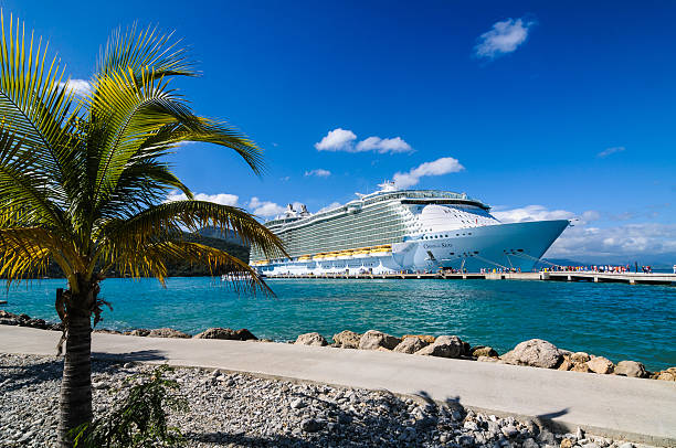 Oasis of the Seas in Haiti Labadee, Haiti-February 3, 2014: Passengers disembark the Royal Caribbean Cruise ship the Oasis of the Seas for a day of beach activities.  With a passenger capacity of over six thousand, the Oasis of the Seas is the largest cruise ship in the world to date. labadee stock pictures, royalty-free photos & images