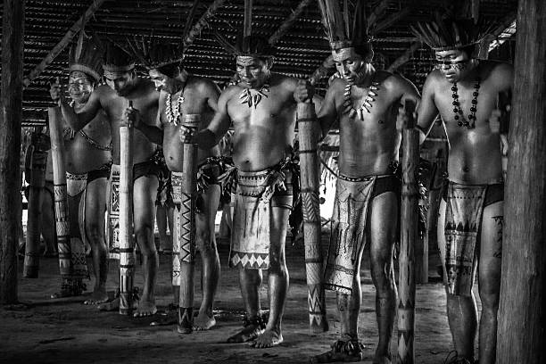 Manaus, Brazil - March 8, 2015: Brazilian indigenous from the Dessana tribe show their ritual during an expedition at the Rio Negro River in the Amazon rainforest.