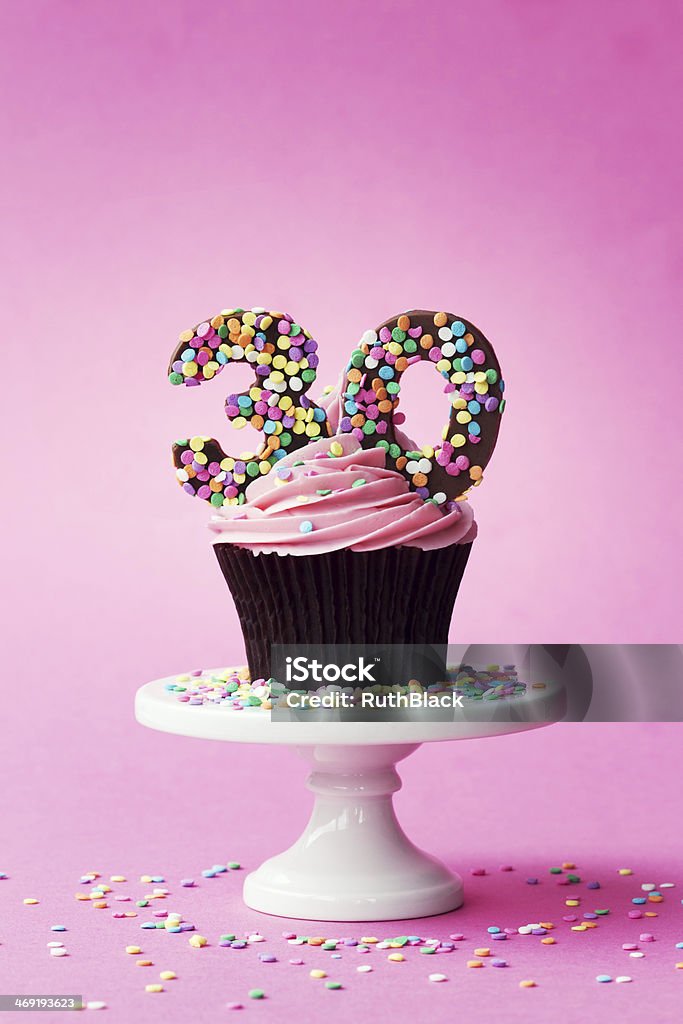 30th birthday cupcake Cupcake decorated with chocolate numbers 30th Birthday Stock Photo