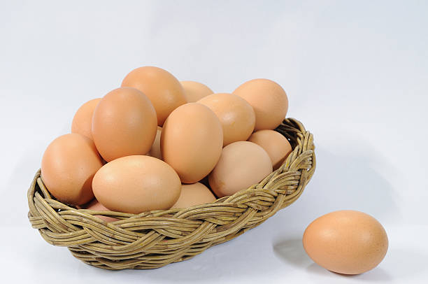 istock Many eggs in rattan basket on white table 469193837