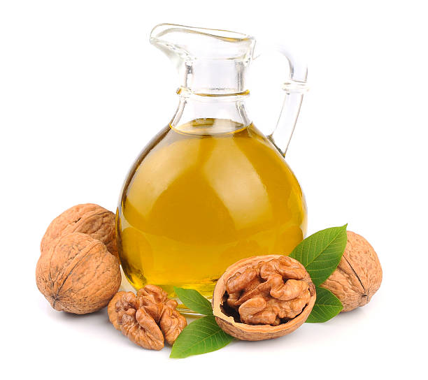 istock Walnuts oil and walnuts isolated 469194435