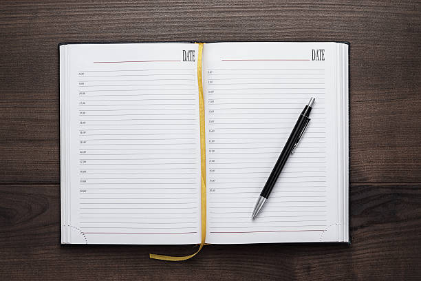 istock opened notebook and pen on wooden table 469194923