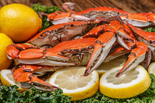 istock Steamed Blue Crabs on a wooden table 469195181