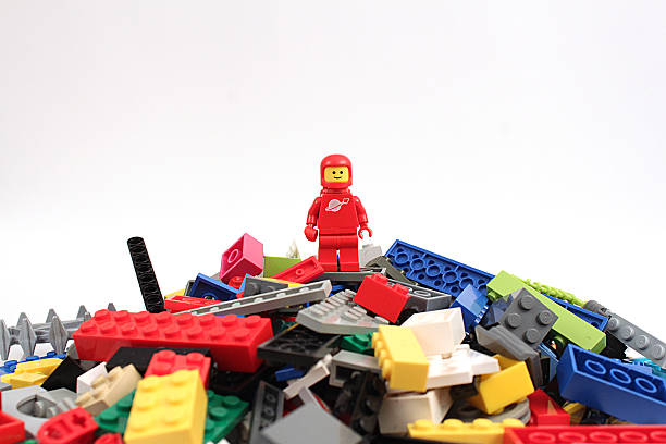 Conquerer Colorado, USA - April 7, 2015: Studio shot of Lego astronaut on bricks. Legos are a popular line of plastic construction toys manufactured by The Lego Group, a company based in Denmark. lego stock pictures, royalty-free photos & images