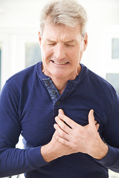 istock Mature Man Suffering Heart At Home 469195640