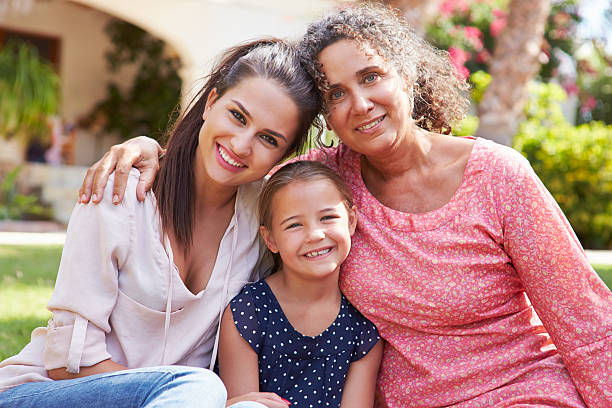 istock Three generations together, happy and smiling outside 469196638