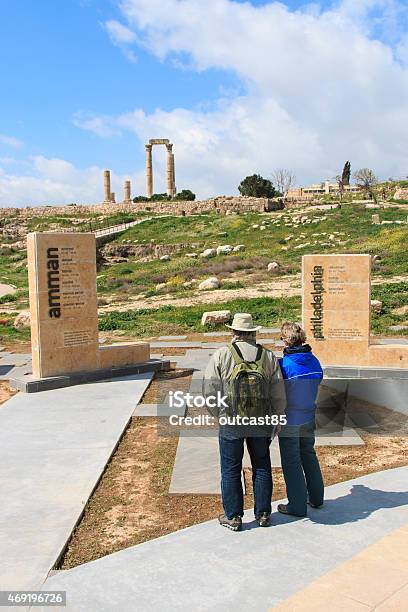 Tourists Standing At The Entrance Of The Citadel In Amman Stock Photo - Download Image Now