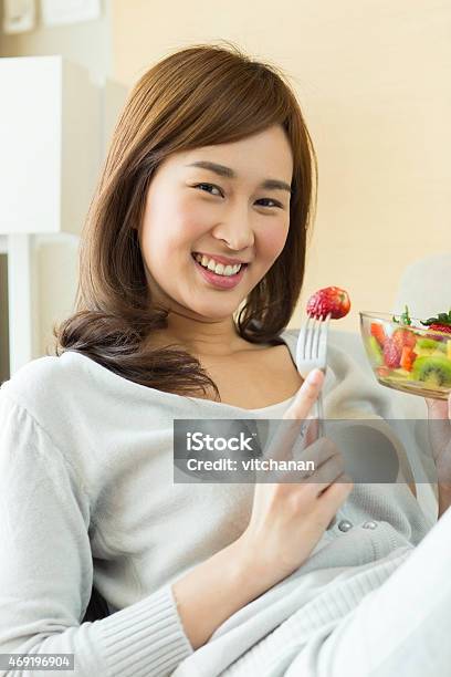 Asian Woman Is Happy Eating Her Fruit Salad Stock Photo - Download Image Now - 2015, Adult, Adults Only