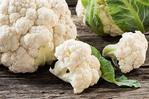istock Organic cauliflower on wooden background 469197230