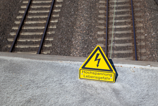 High Voltage - Danger for your life sign, railroad track