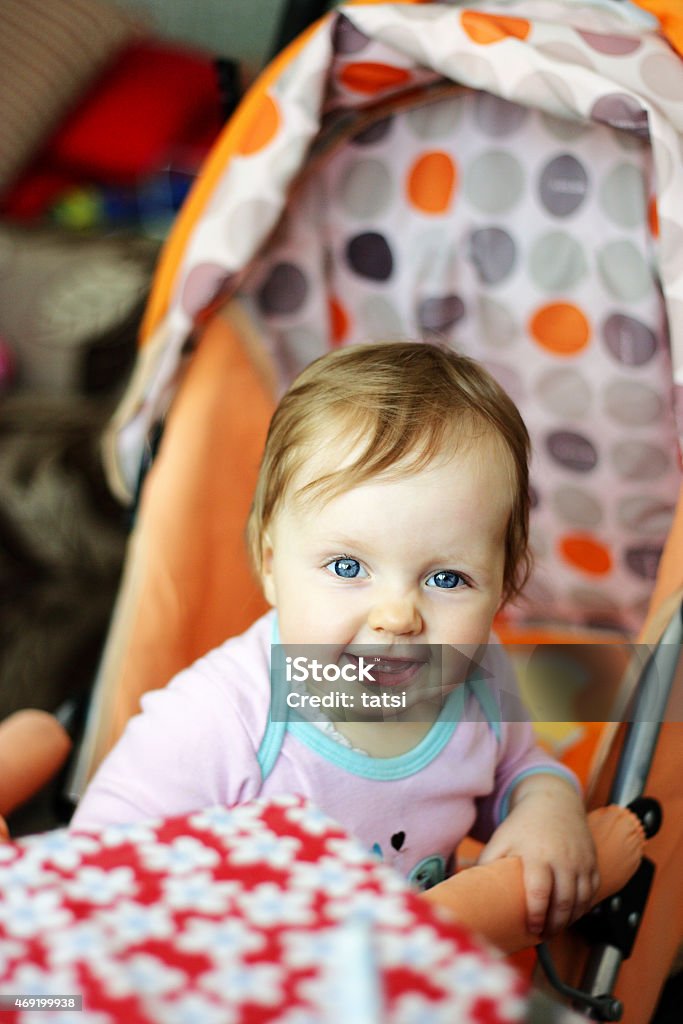 Smiling Baby 11 months old baby smiling at the camera. Vertical colour photo taken in Minsk, Belarus. 2015 Stock Photo