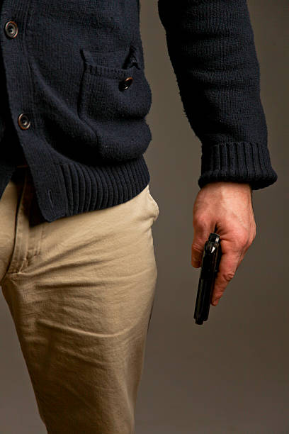 istock Man Holding A Pistol 469200137