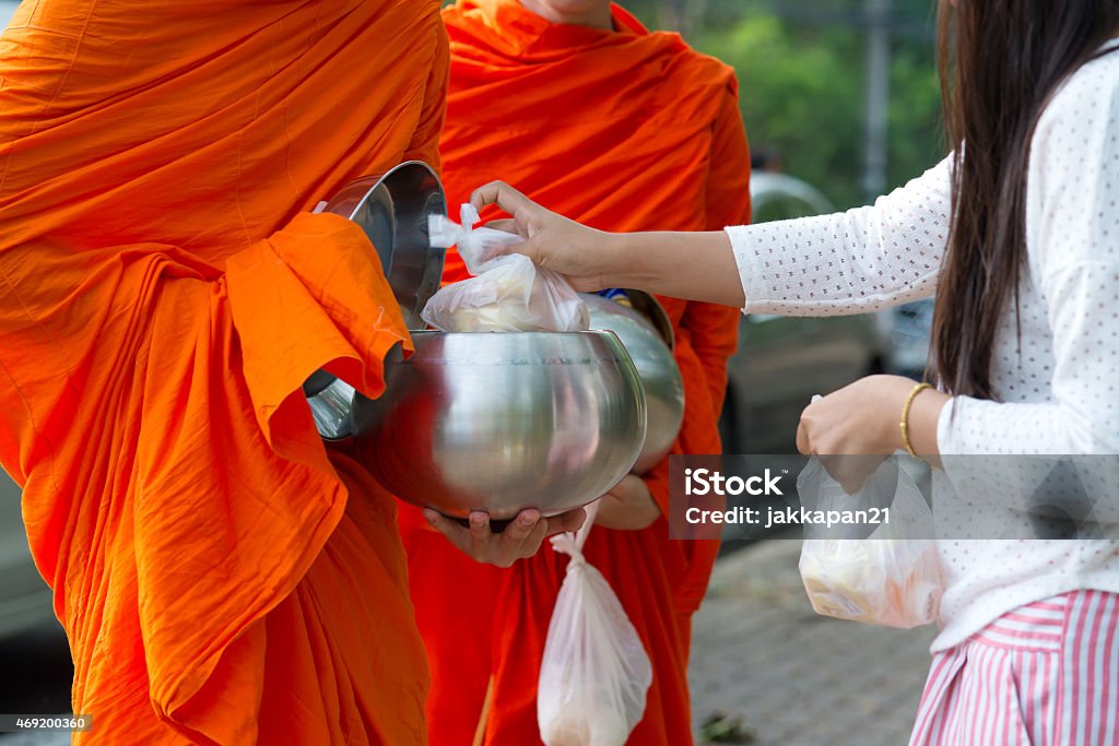 monks  receive alms Buddhists have faith in Buddhism. giving alms to monks  receive alms Buddhism Stock Photo