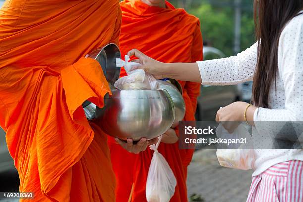 Monks Receive Alms Stock Photo - Download Image Now - Buddhism, Monk - Religious Occupation, Receiving