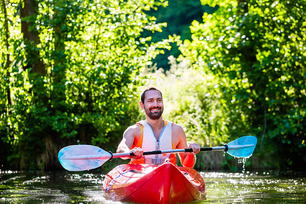 istock Man paddling with kayak on river for water sport 469200854
