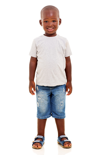 happy young african boy standing on white background