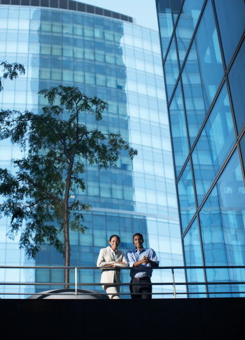 Portrait of Two Businesspeople on Foot Bridge