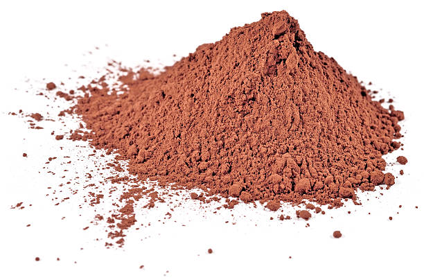 istock Heap of cocoa powder on a white 469207198