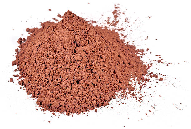 istock Heap of cocoa powder on a white 469207200