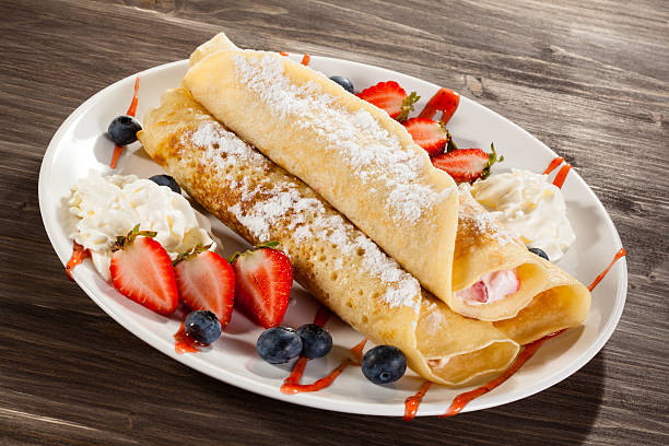 istock Pancakes with cream and fruits 469207428