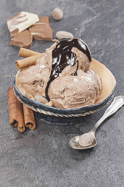 istock Ice cream with nuts and chocolate topping 469211366
