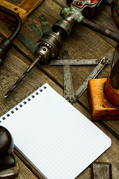 istock Paper with pencil and the vintage working tools on wooden 469211722