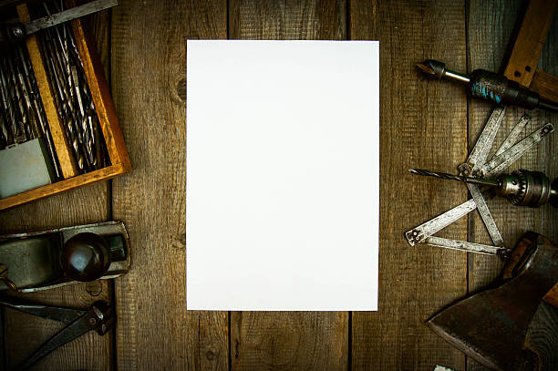 istock Paper with pencil and the vintage working tools on wooden 469211724