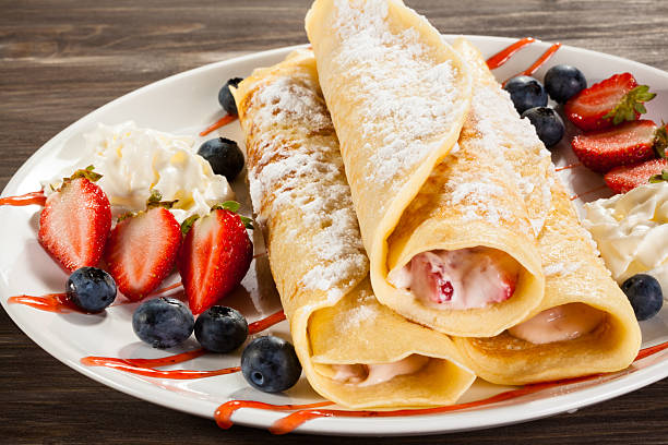 istock Pancakes with cream and fruits 469211988