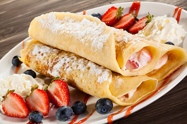 istock Pancakes with cream and fruits 469211990