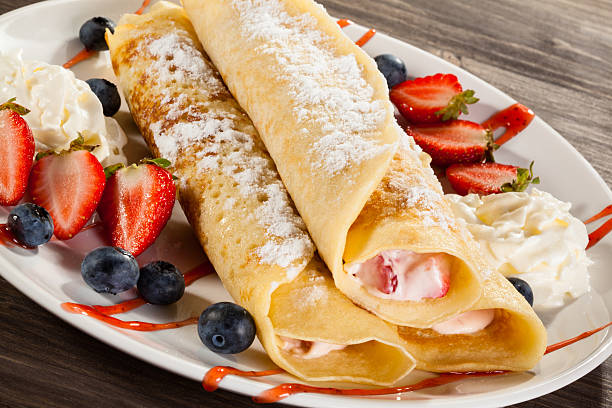 istock Pancakes with cream and fruits 469211992