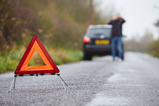 istock Motorist Broken Down On Country Road Phoning For Help 469212308